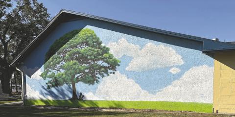 “Tranquility Tree” by James Margary, Kissimmee’s first foray into “augmented art”, is located on the back wall of the American Legion Post 10 Building. PHOTOS/ DAVID CHIVERS