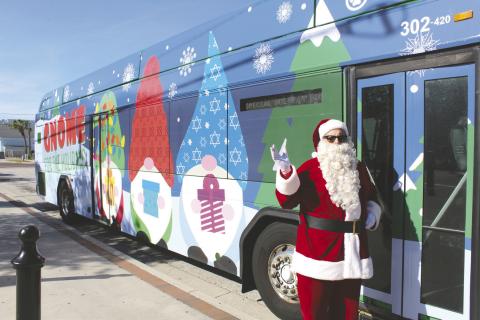 Santa—a.k.a. LYNX bus driver Edwin Cartagena—made some riders’ day. Those who rode on his Monday routes through Kissimmee and St. Cloud got a free ride. PHOTO/KEN JACKSON