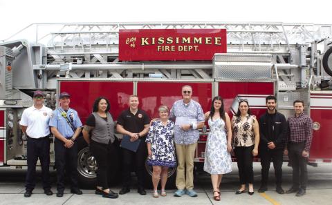 Robert Walter (fifth from right) with his family and the legion of responders who helped revive him from an April 25 cardiac incident and survived to help honor them Tuesday. (Photo/Ken Jackson)