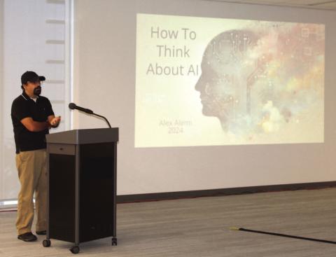 Dr. Alex Alemi speaks to the myths, misconceptions and misinformation surrounding Artificial Intelligence at an Oct. 3 event at NeoCity. PHOTO/TERRY LLOYD
