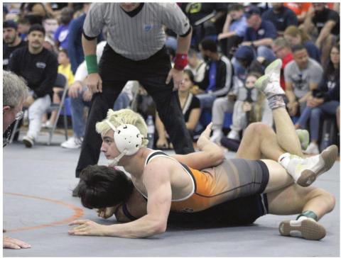 Harmony’s J.C. McNichols (top) pins Freedom’s Eric Aja Saturday to win the Region 3A-3 championship Saturday. He’ll vie for the 138-pound Class 3A championship this weekend at the Silver Spurs Arena. SUBMITTED PHOTO