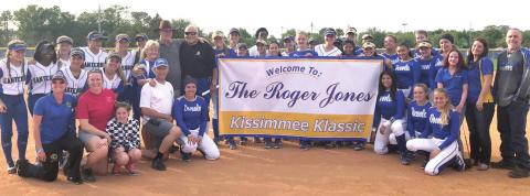 The Kissimmee Klassic softball tournament was re-named in honor of Roger Jones (in hat standing to left of banner) in 2018 prior to his passing away later that year. The showcase tournament begins today at the Fortune Road softball complex. PHOTO/OSCEOLA H.S.