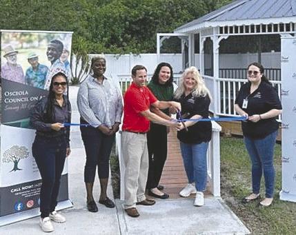 St. Cloud Mayor Chris Robertson, City Manager Veronica Miller and Wendy Ford from the Council on Aging cut the ribbon at Tracey Manor, officially unveiling the Council’s Community Development Block Grant. (Photo/Osceola Council on Aging)
