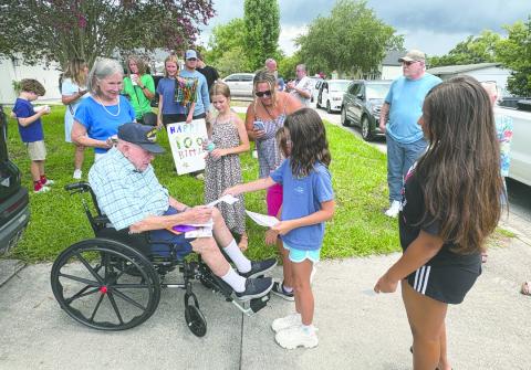 Friends and neighbors wish U.S. Navy veteran Oather Gardner a happy 100th birthday Sunday. (Photo/Terry Lloyd)