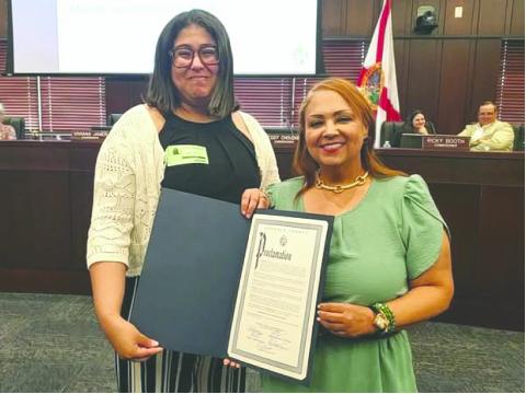 Nicole Santiago from the Osceola Council on Aging was presented with an Alzheimer’s and Brain Awareness Proclamation for the Council’s Adult Day Care &amp; Health Clinic by Osceola County Commission Chair Viviana Janer. (Photo/Osceola Council on Aging)