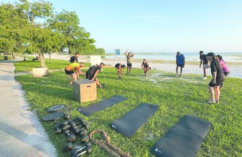 Team BLUFO warms up at the St. Cloud Lakefront before a workout session. (Photo/Terry Lloyd)