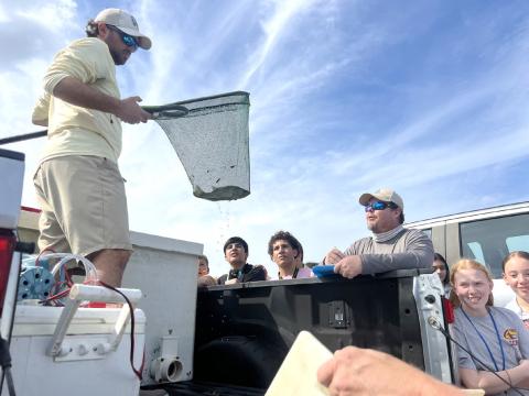 Florida Fish and Wildlife Commission biologists delivered research study fish to St. Cloud Middle School’s STEM fishing class last week. The class can then catch them to provide scientific research. SUBMITTED PHOTO 