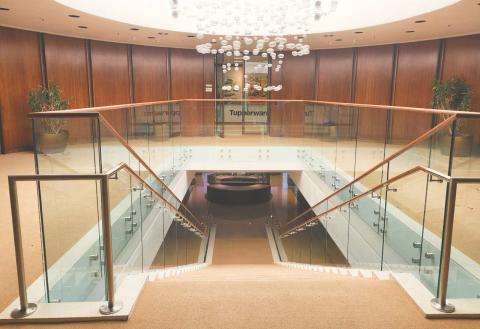 An ornate chandelier still stands at the top of stairs that once led to Tupperware executive offices. (Photo/Ken Jackson) 