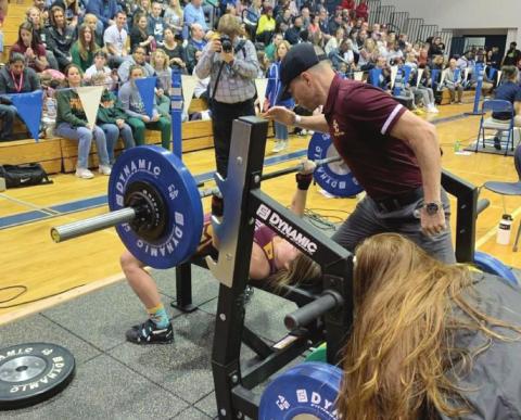 PHOTO/ST. CLOUD WEIGHTLIFTING St. Cloud senior Kaylin White successfully lifts 150 pounds in the bench press to help her capture the FHSAA State Championship in the 110-pound weight class.