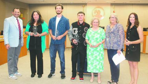 From left, Bettina Grzeskowiak, Logan Harrolle, Dalton Gould and Silvana Vitale were honored May 27 as the Osceola County School District’s Volunteers of the Year. (Photo/Ken Jackson)