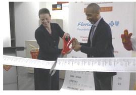 Valencia College President Dr. Kathlee Plinske cutting the ribbon of its second VCentials location on its Osceola campus on Monday morning with Florida Blue Central Florida Market President Tony Jenkins. (Photo/Emely Albelo)