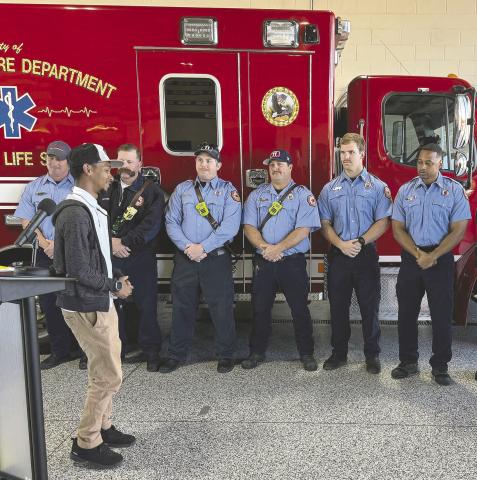 Josean Almonte turns to thank responder at a ceremony held last week at Kissimmee Fire Station 11. PHOTO/DAVID CHIVERS