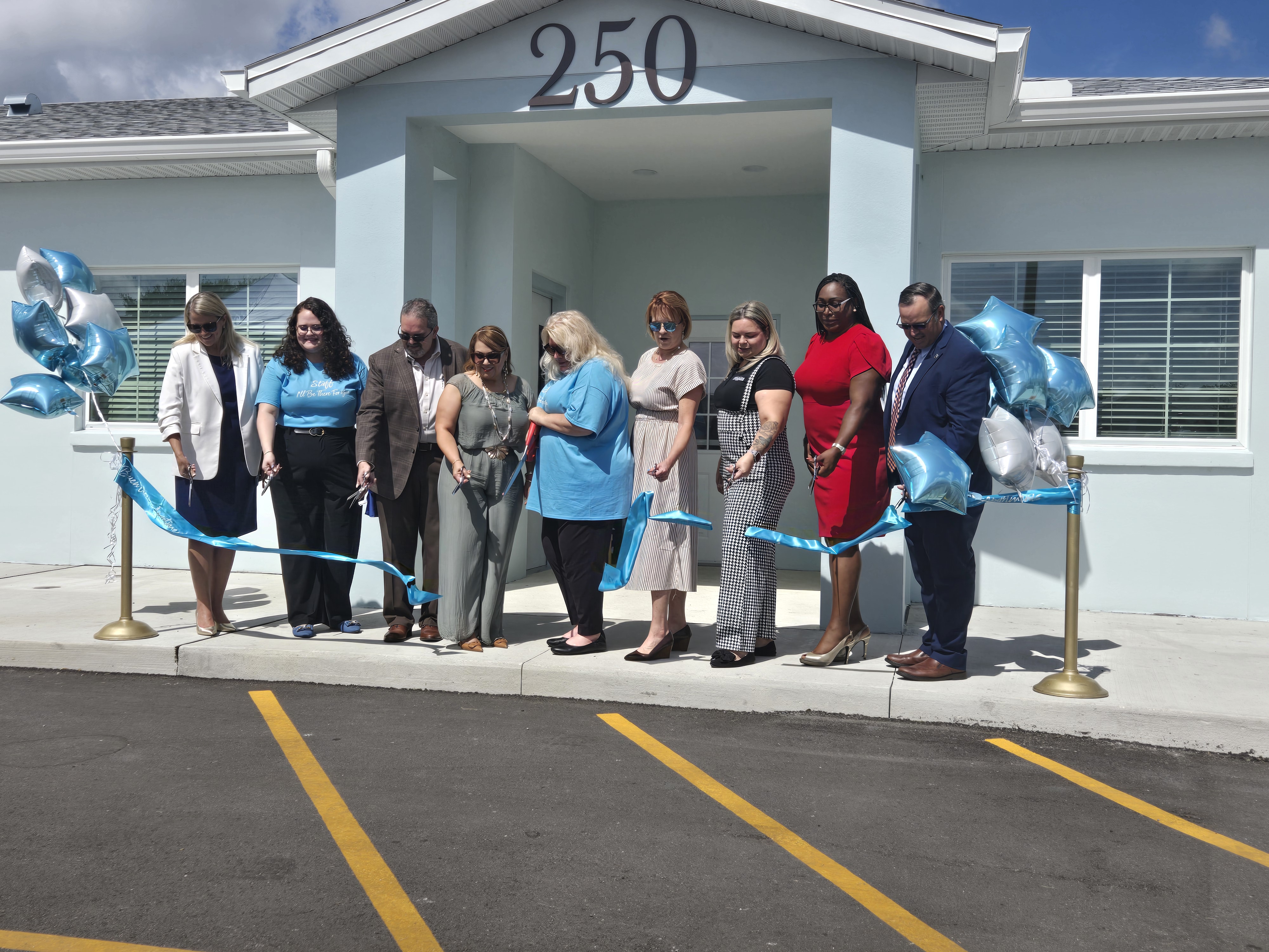 City, County, State and Osceola Council on Aging officials cut the ribbon Friday at the Buen Vecino senior affordable living community in Buenaventura Lakes. (Photo/Ken Jackson)