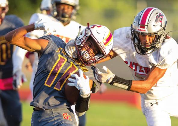 St. Cloud running back Jolaney Quinones tries to avoid a Gateway tackler in Monday’s 22-12 victory over the Panthers, who forced five turnovers in the game. PHOTO/ROB HERBERT
