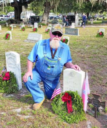 Commander Al Messey laid wreaths for two confederate soldiers Saturday during the Wreaths Across America commemoration at Mount Peace Cemetery. PHOTO/CHRIS MILLER