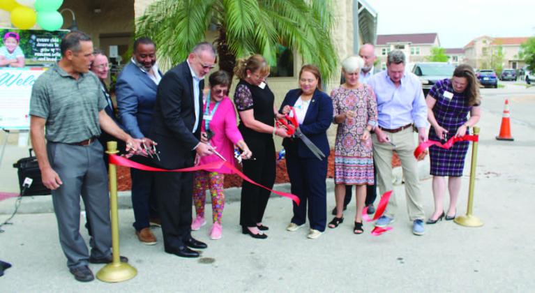Osceola County and Children’s Advocacy Center of Osceola County officials cut the ribbon on its new intake facility in Kissimmee April 12. The new space includes about triple the amount of interview, therapy and exams rooms. PHOTOS/KEN JACKSON