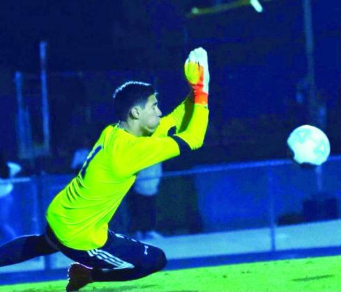 Chris Vargas stops a shot during Celebration’s regional win over Jupiter. Vargas allowed just 11 goals in 18 games and recorded 11 shutouts. PHOTO/HARMONY HIGH SCHOOL
