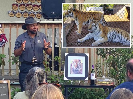 Dr. “Simba” Wiltz goes over caring for the big cats at the Central Florida Animal Reserve’s “Sip and Stroll” on Dec. 16. SUBMITTED PHOTOS