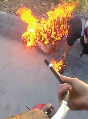 Deputy Benjamin Maclean’s body camera shows him coming to extinguish flames on Jean Barreto during a Feb. 27 arrest and subsequent fire. VISUAL/OSCEOLA CO. SHERIFF