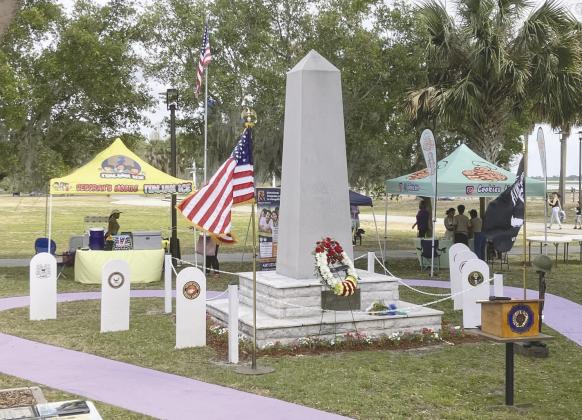 At the Osceola County war memorial, collocated with American Legion Post 10, “Taps” was performed by the Osceola County Veterans Council Honor Guard after firing a 21-gun salute. PHOTOS/TERRY LLOYD