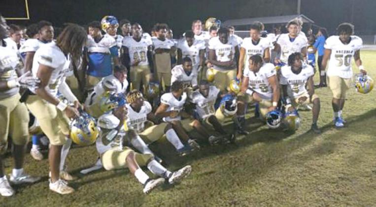 The Osceola Kowboys gather after their narrow 28-21 playoff win Friday over Newsome. PHOTO/DAN PEARSON