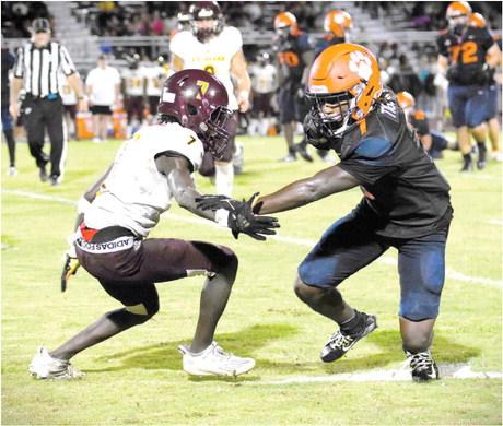 Tohopekaliga’s Delvin Prior (1) tries to gain yardage while St. Cloud’s Tashard Smith moves in for the tackle in the Tigers’ 41-19 win over the Bulldogs. Toho will look to move to 4-0 Friday against Melbourne, while St. Cloud goes to Winter Springs to again find winning ways. PHOTO/KATIE WILLIAMS