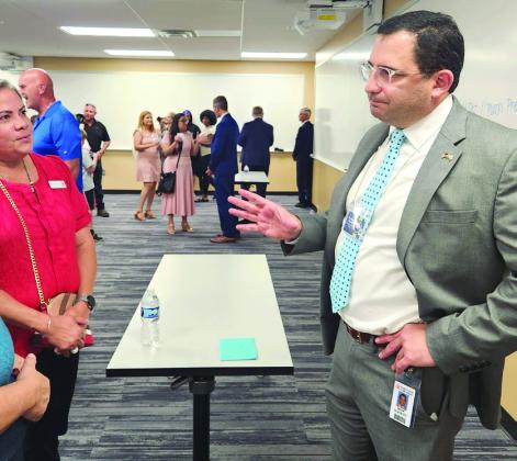 Dr. Mark Shanoff (foreground) and Terrence Connor, and Dr. Michael Allen meet with the public at Monday’s event at Valencia College. PHOTOS/KEN JACKSON