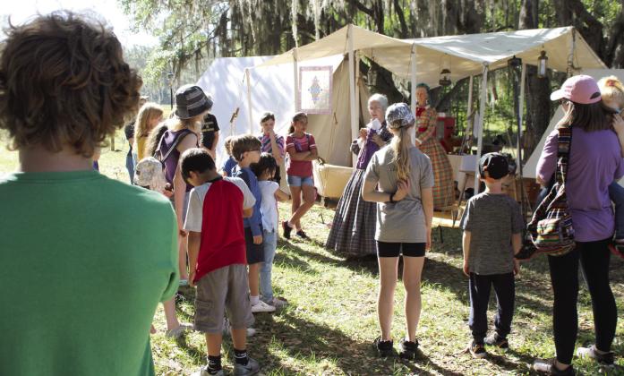 school group learns about Civil War era domestic life from living history interpreters “Miss Lizzie” and “Mrs. Genie.” PHOTO/TERRY LLOYD