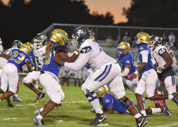 Osceola linebacker Joel Campbell gets the better of Dr. Phillips lineman Payton Kirkland, 140 pounds bigger, in Friday’s 26-6 win. PHOTO/JANA STULTZ