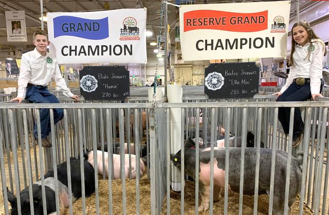 Blake Jeannin and his hog, Hamie, weighed in at 270 pounds, winning the top award – 2020 Market Hog Grand Champion. His twin sister, Bailee Jeannin, and her hog, Ellie Mae, weighing in at 284 pounds, took the Reserved Grand Champion seat. SUBMITTED PHOTO