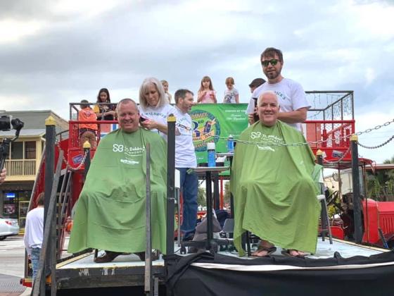 From left are Kissimmee Police Chief Jeff O'Dell and Kissimmee Fire Chief Jim Walls at the St. Baldrick's event in 2019. Photo/#2019 Shavefest Facebook page