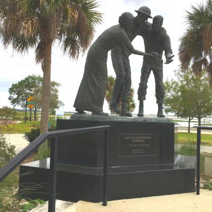 Sculpted by artist Sandra M. Storm, the Bataan-Corregidor Memorial was dedicated on May 20, 1995. The bronze statue of three figures is in the northeast corner of Kissimmee Lakefront Park.