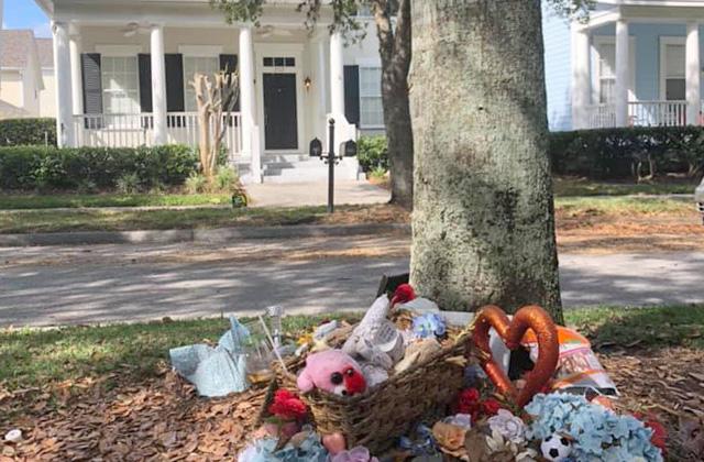 Toys and other items are found in front of the Celebration home where the Todt family victims were found. PHOTO/FACEBOOK