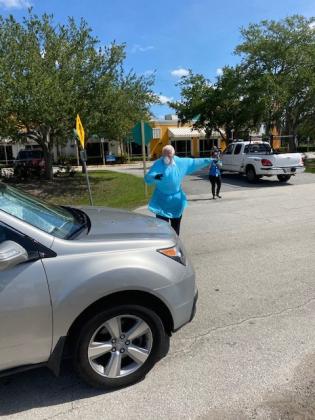 Kissimmee Fire Chief Jim Walls helps direct traffic. NEWS-GAZETTE PHOTO/BRIAN MCBRIDE