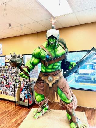 The new statue Gladiator Hulk was unveiled at the Coliseum of Comics store in Kissimmee on Wednesday. NEWS-GAZETTE PHOTO/BRIAN MCBRIDE