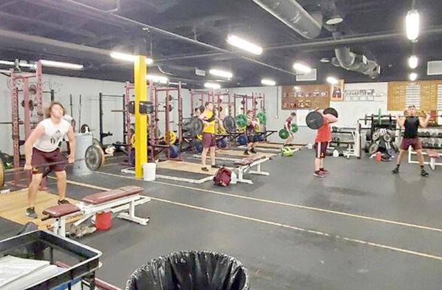Using social distancing guidelines, the St. Cloud football team hit the weight room in small groups during workout sessions.  Photo courtesy of Bryan Smart/St. Cloud Football