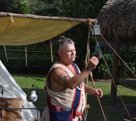 Swamp Cabbage (Stephen Teeter) demonstrates fire-making at the Seminole camp at Pioneer Village. Living History Day at Pioneer Village on Nov. 14 will feature Seminole demonstrations, storytelling and a mini archaeology dig for children.