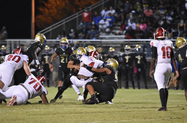 A bevy of Osceola defenders brings down Edgewater running back CJ Baxter (No.4).  The Eagles won the game on a last second fumble that was returned for a touchdown.  (Photo courtesy Jana Stultz /Osceola High School)