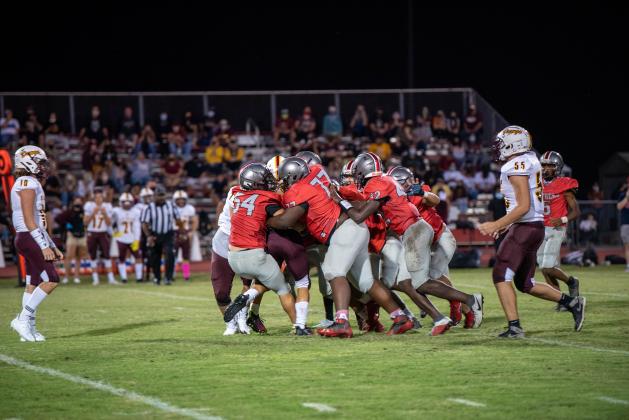 A bevy of Gateway tacklers gang up to hold St. Cloud running back Patrick Forsyth to a short gain.  Forsyth would get his revenge, rushing for 158 yards on the night.  (Photo Courtesy Mitchell Nelson / Gateway High School)