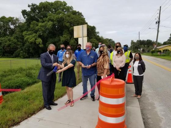 The city of St. Cloud on Tuesday held a ribbon cutting to officially open the new 17th Street sidewalk.