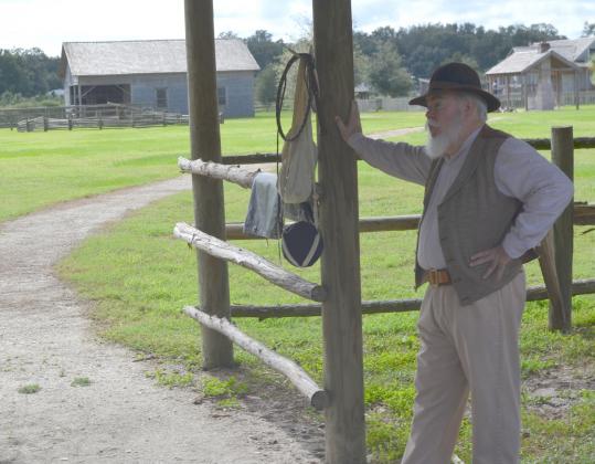 Retired history teacher John Holmes shares the history of the Florida cow hunters at Pioneer Village.