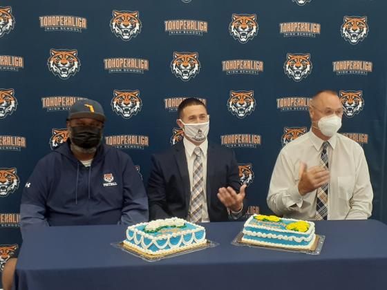 Assistant Football Coach Chris Biggz, left, and Assistant Coach Chris Johnson, right, introduce new head football coach Jeff Higgins on Wednesday afternoon. News-Gazette Photo/ J. Daniel Pearson