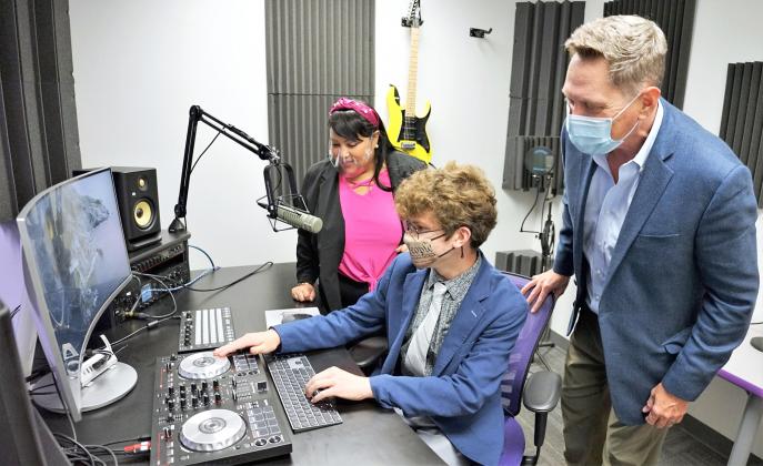 Osceola County Commission Chairman, Brandon Arrington right, and Commissioner Viviana Janer watch Library Advisory Board member Noah Ziegler operates an audio station that is available for podcasts and other work at TechCentral the Hart Memorial Library. PHOTO/OSCEOLA COUNTY
