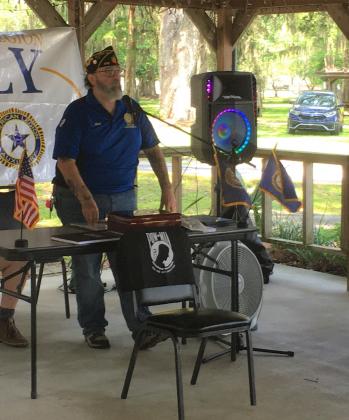 Post 412 Commander Bill Musto addresses the crowd at Saturday's officer installation at East Lake Fish Camp. PHOTO/TERRY LLOYD