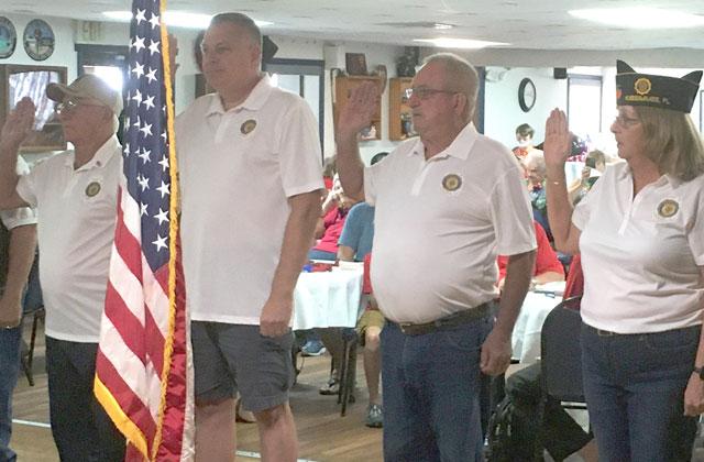 Right: Ritchey (at right) is sworn in during Saturday’s ceremony. PHOTO/TERRY LLOYD