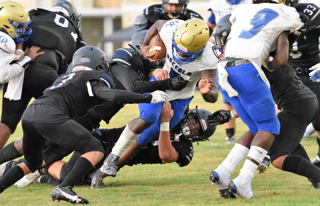 Ja’Randy Swint carried for 65 yards, some tough like this, in Osceola’s 28-0 Kickoff Classic win over Lake Nona. PHOTO/JANA STULTZ