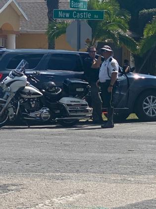 Osceola County Sheriff's deputies block off streets during a police standoff Tuesday in Poinciana. PHOTO/ROCHELLE STIDHAM