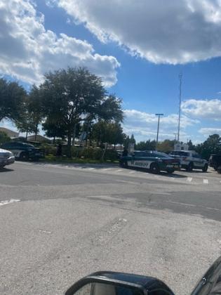 Osceola County Sheriff's deputies block off streets during a police standoff Tuesday in Poinciana. PHOTO/ROCHELLE STIDHAM