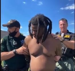 Police take Naiheem Charlin into custody for his role in a shooting Tuesday in Poinciana. PHOTO/OSCEOLA COUNTY SHERIFF'S OFFICE