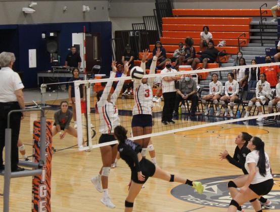 Tohopekaliga's Paige Patterson (3) and Alexa Ortega (7) block a Celebration hit attempt in Thursday's three-set win. PHOTO/KEN JACKSON